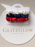 GlitzGlow Atelier satengscrunchies – håndlaget i tre vakre farger